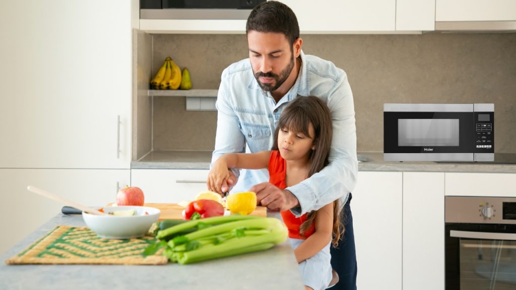 Father and daughter cooking